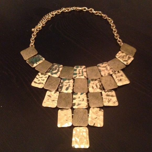 Gorgeous gold colored metal statement necklace