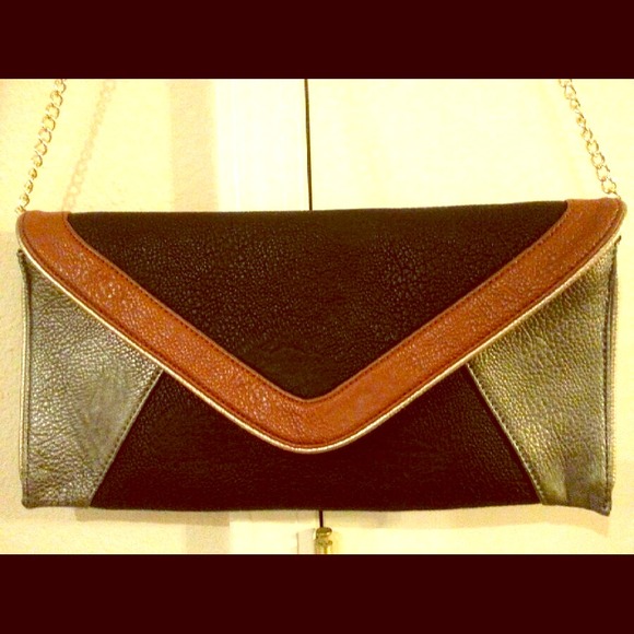 Sold Steve Madden Black and Tan geometric clutch