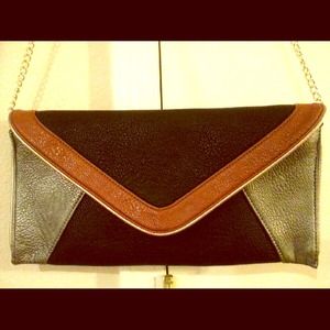 Sold Steve Madden Black and Tan geometric clutch