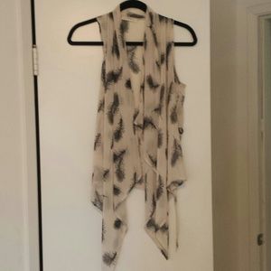 Ivory feather print vest.