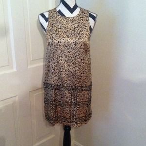 Silky type sheath dress with decorative bottom.