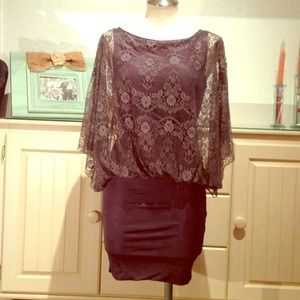 Grey dress with lace overlay.