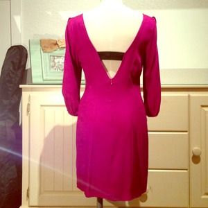 Fuchsia cocktail dress with open back.