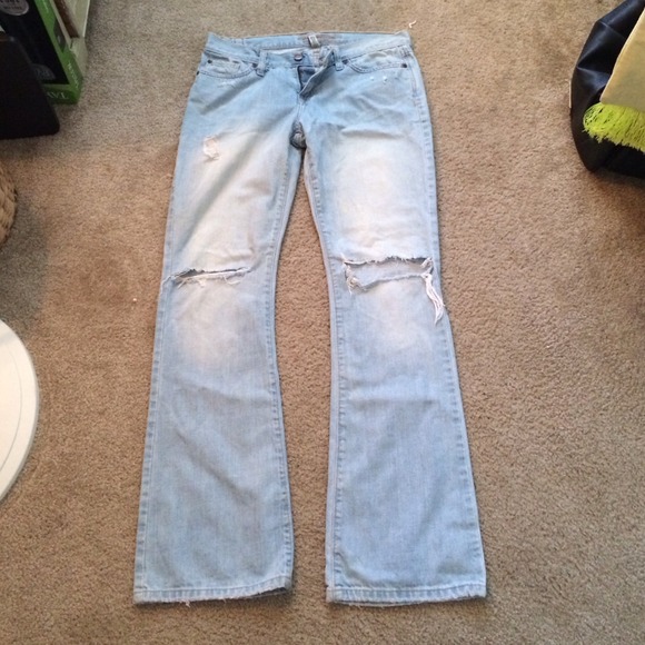 Light wash destroyed flare jeans