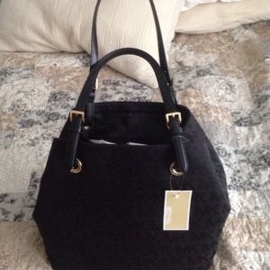 NWT Michael Kors black jet set purse.