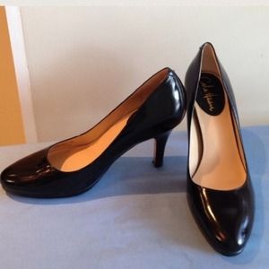 Cole Haan black pumps Nike air technique.