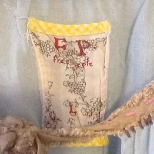 Free People light blue shirt w/shells on sleeves