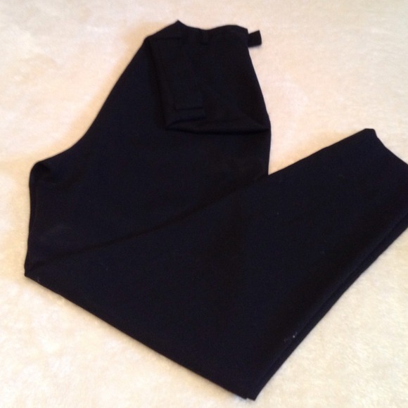 Black wool pants with belt loop and skinny leg.