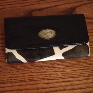 Brown and cream cow pattern wallet. Never used!