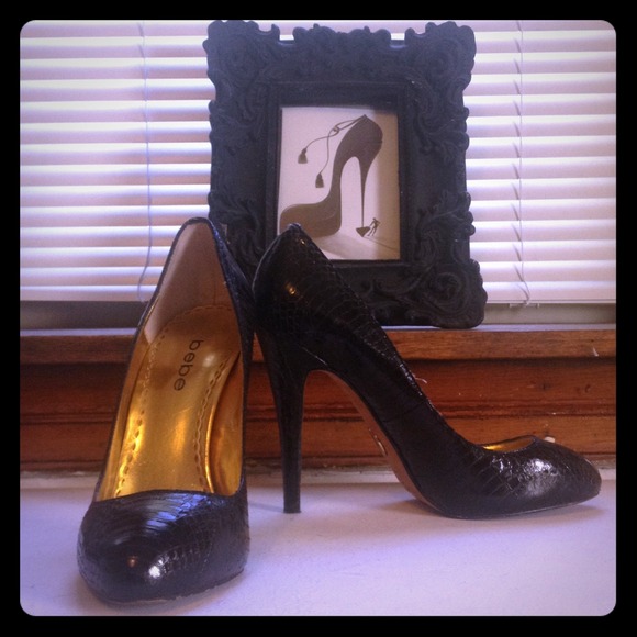 Bebe black  snake skin pumps.