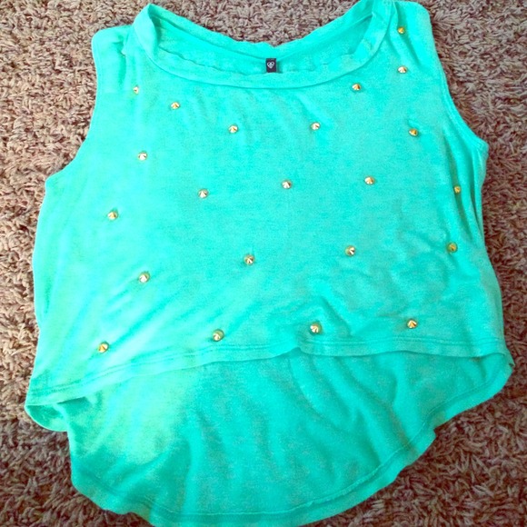 Blue crop top with gold studs.