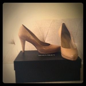 Nude patent pumps