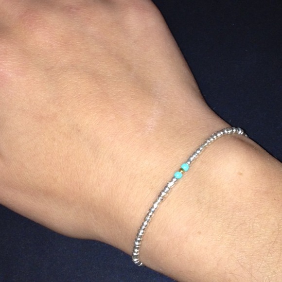 Stretchy silver bracelet with turquoise and gold