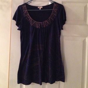 Loose for blue top with gold designs.