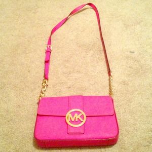 Small hot pink Michael Kors cross body bag.