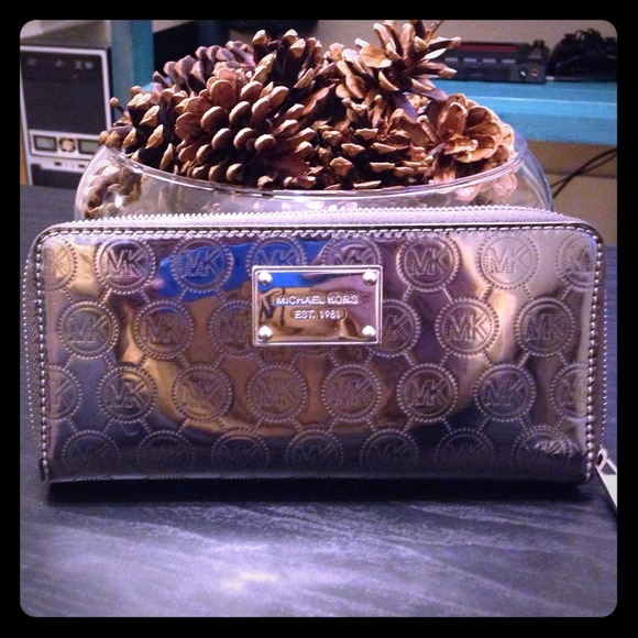 Silver metallic authentic MK wallet.
