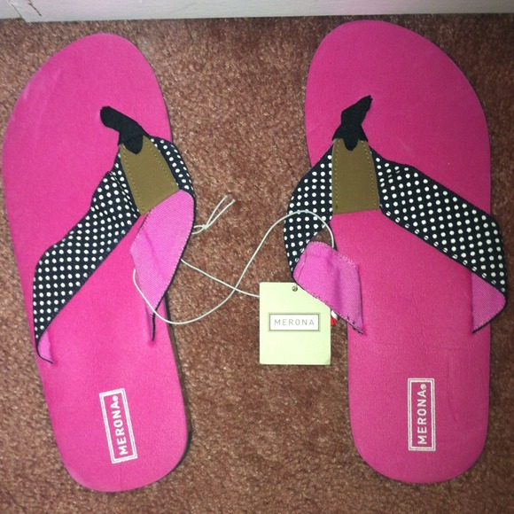 Pink and black flip flops