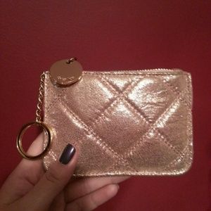 Rose gold colored coin purse