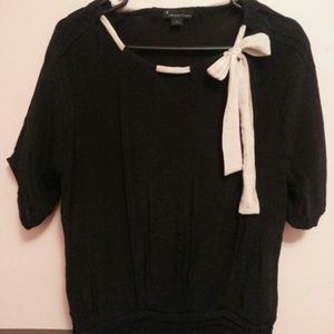 Black blouse with cream bow