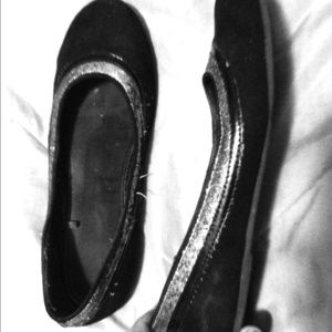 Black slip-ons, silver trim. Size 9.