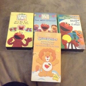 Bundle of VHS tapes with green Mickey zip up