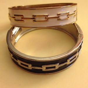 White and black express bangles.