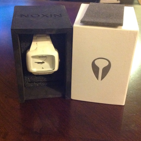 White NIXON watch.