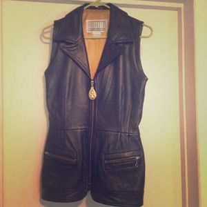 Black leather vest with gold zipper and accent