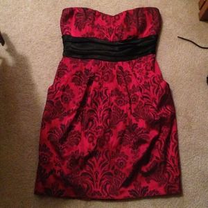 Red pattern dress with tie back.