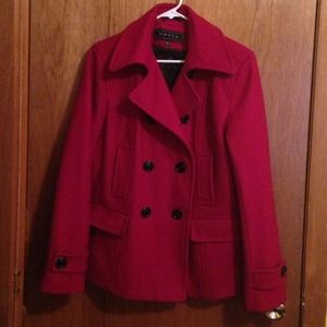 Warm red peacoat with black buttons