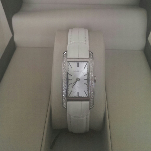 Burberry diamond watch with white alligator band.