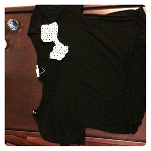 Very cute layering top with a bow accent!