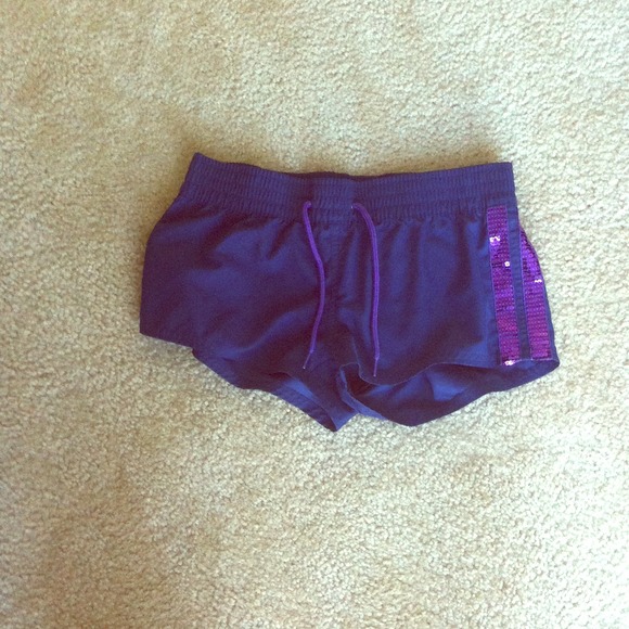 Purple swim shorts.