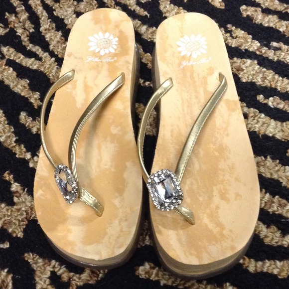 Yellow box flip flops