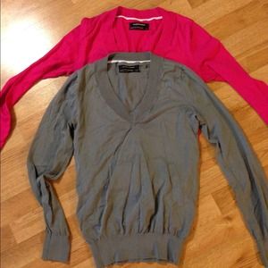 Two Club Monaco vneck sweaters.