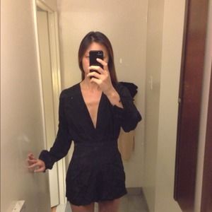Black one piece romper bought on nastygal.