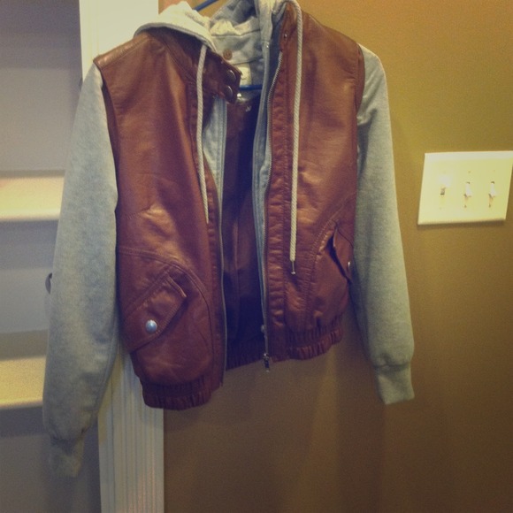 Brown leather jacket, with gray sleeves and hood.