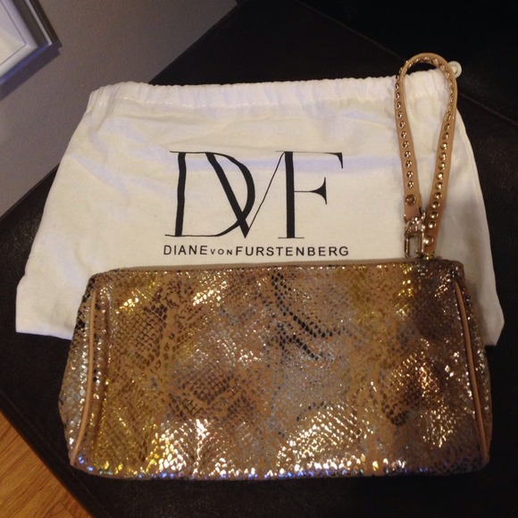 Sold!!!! DVF wristlet gold with silver, like new