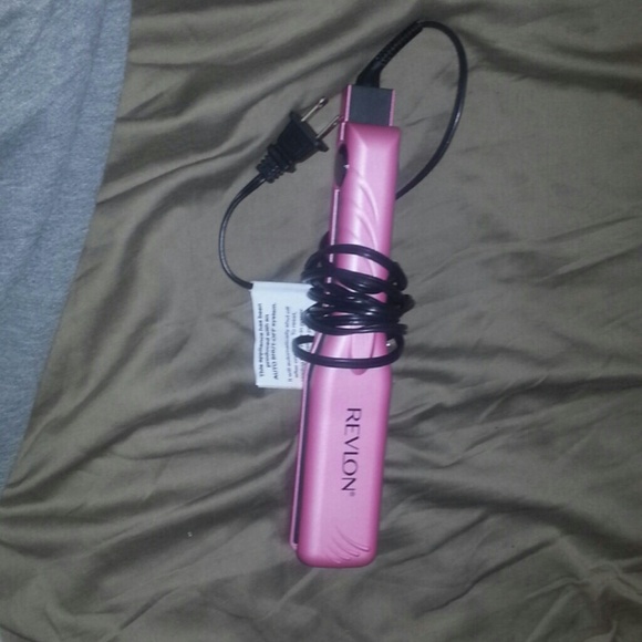 Brand new. Revlon pink hair straightener.