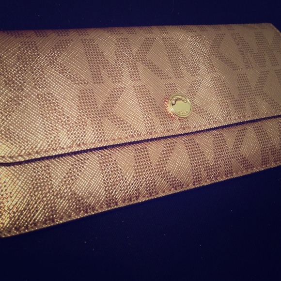 Michael Kors rose gold clutch/wallet