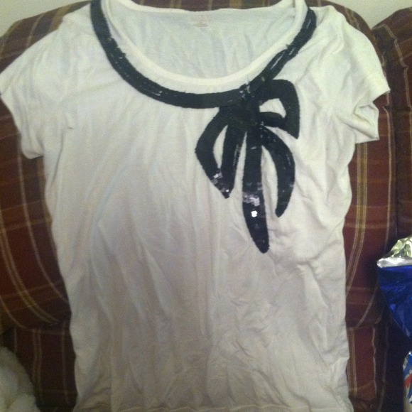 White top with black sequins bow