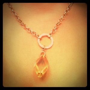 Necklace w/ single jewel charm.