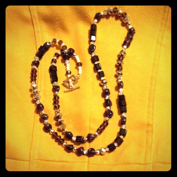 Long purple stone necklace.