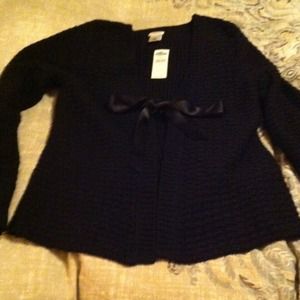Black sweater with tag still attached. Never worn
