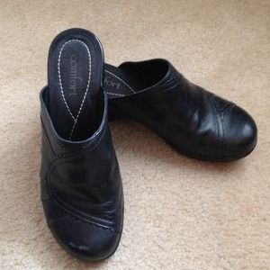 Strictly Comfort black clogs.