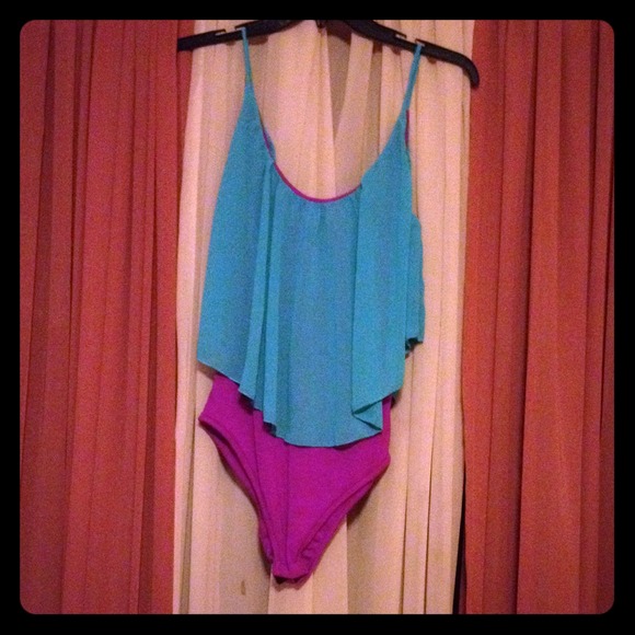Pink and turquoise leotard.
