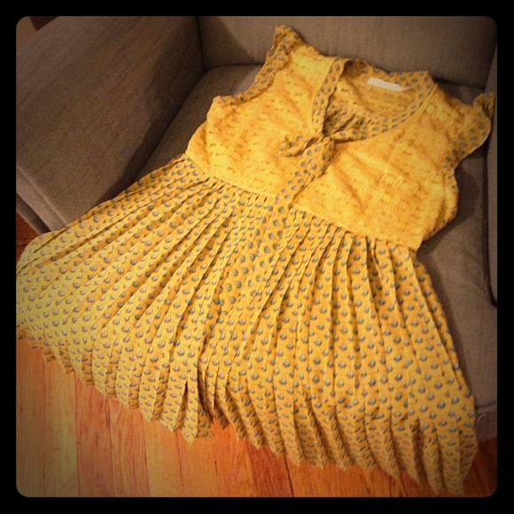 Yellow Top with Blue Detailing.