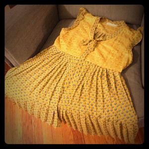 Yellow Top with Blue Detailing.