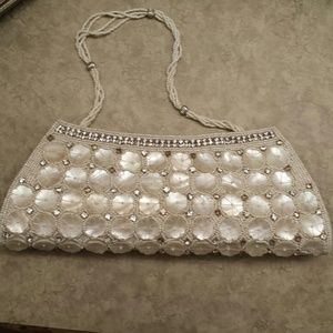 A white sparkle clutch