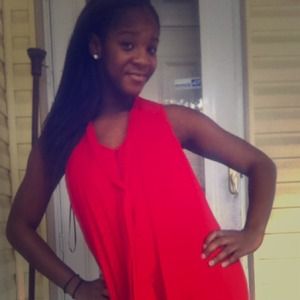 A red peplum button down dress by Chetta B